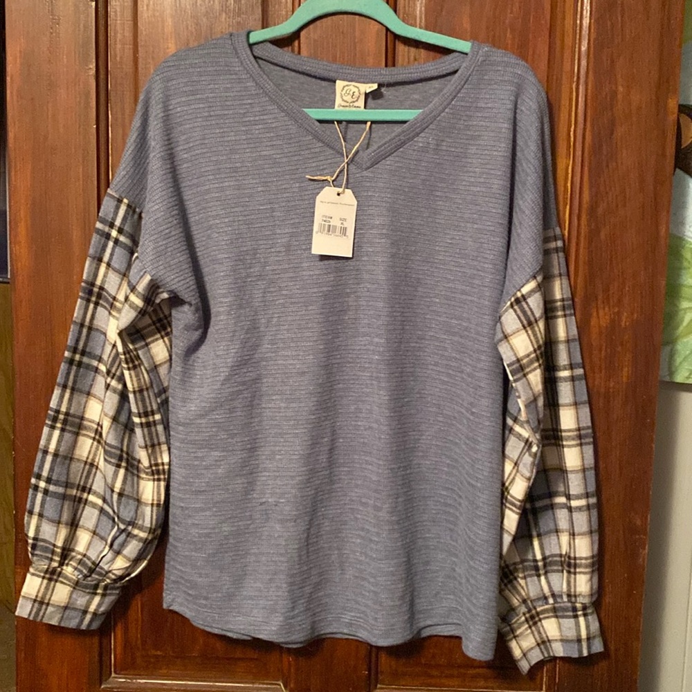 Blue and with plaid sleeves shirt